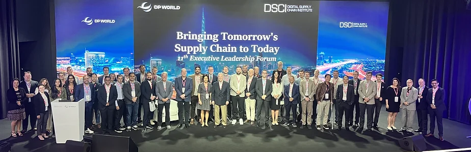 A group of people stood on stage with blue lighting in the background, in Dubai at the ELF 2023 event.