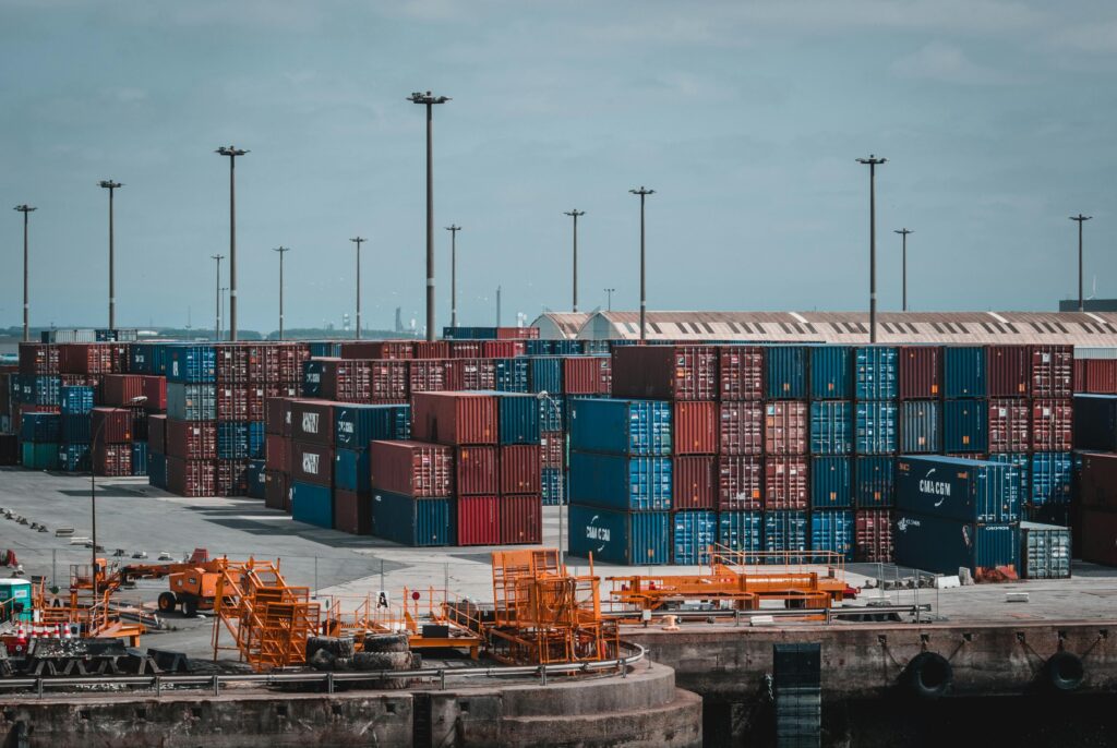 An image of shipping containers stacked on portside